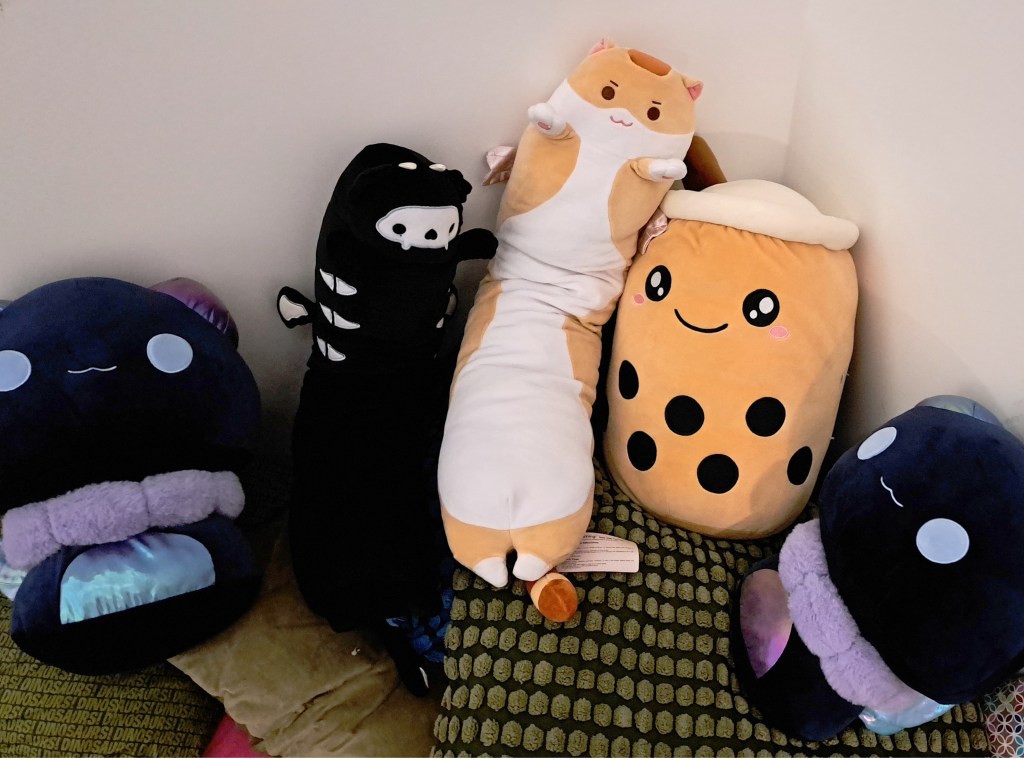 A pile of several large plushies. They are very soft and big enough for hugs.